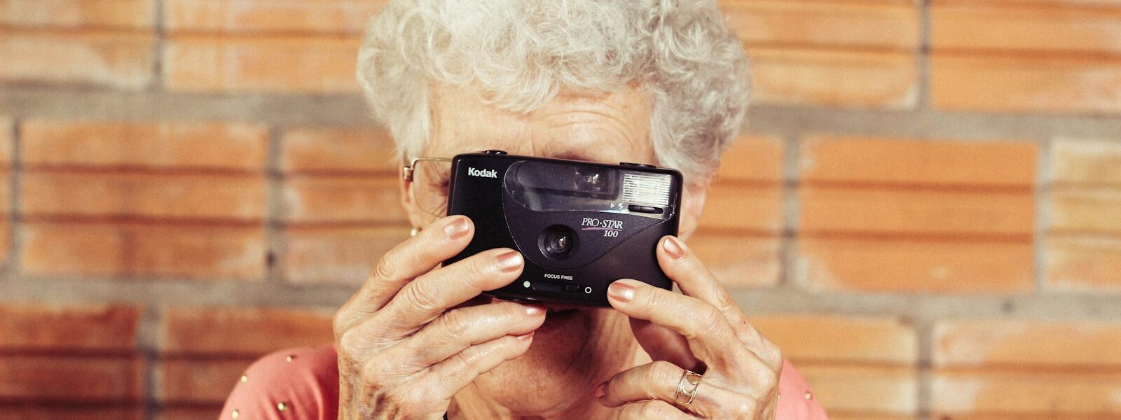 woman holding film camera